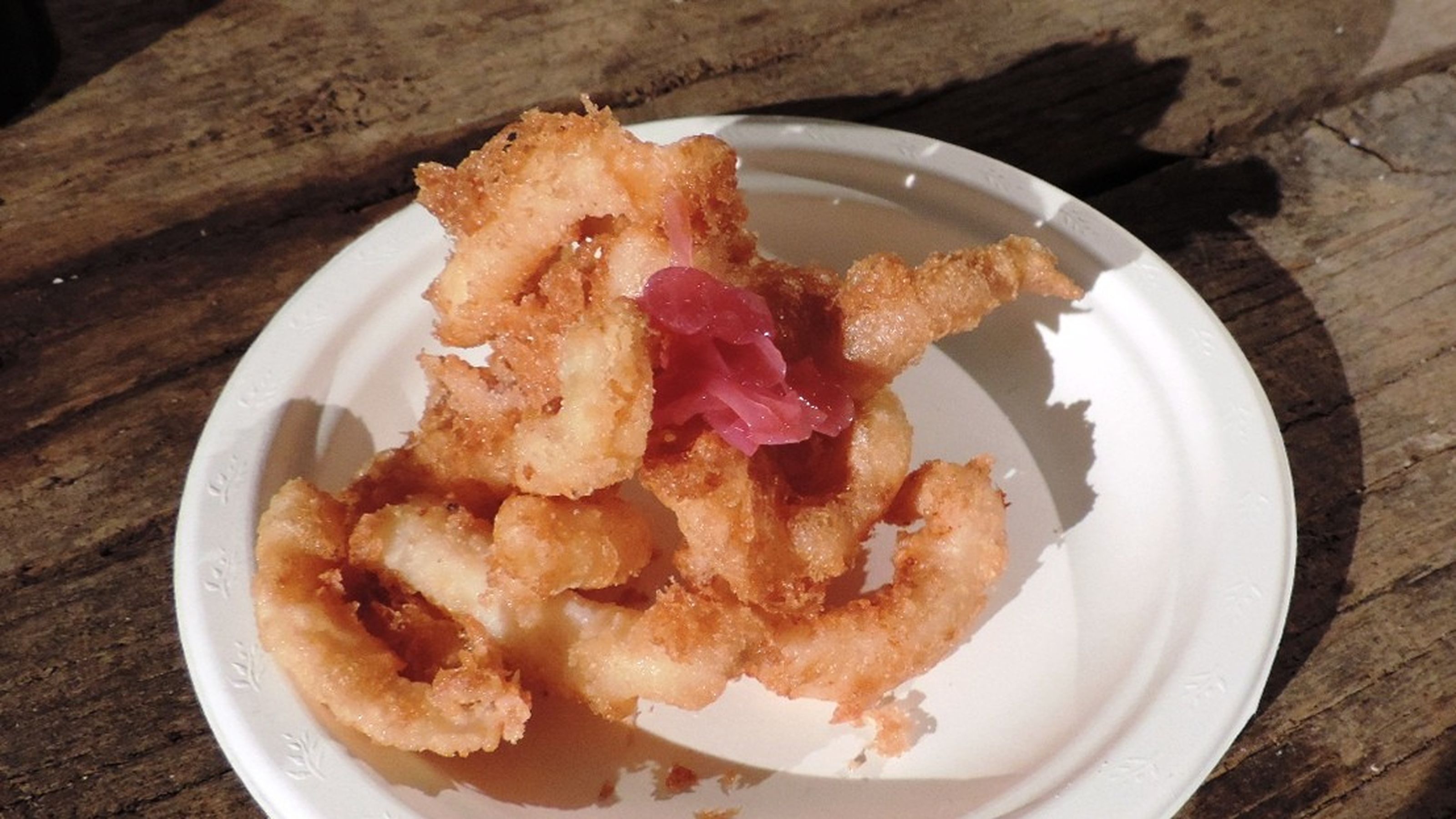 tempura di calamari in composta di arance e cipolle
